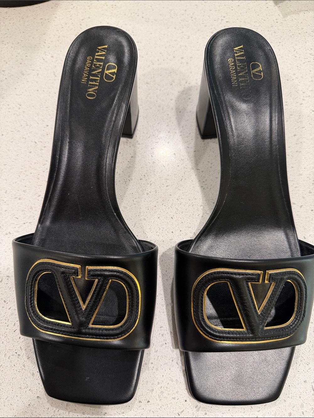 Valentino Garavani Black Leather Logo Block Heel Mules with Gold Accent